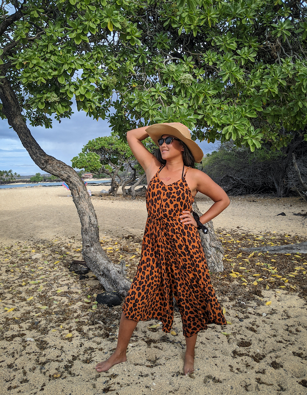 hawaii outfit idea leopard print romper with wide brim straw hat