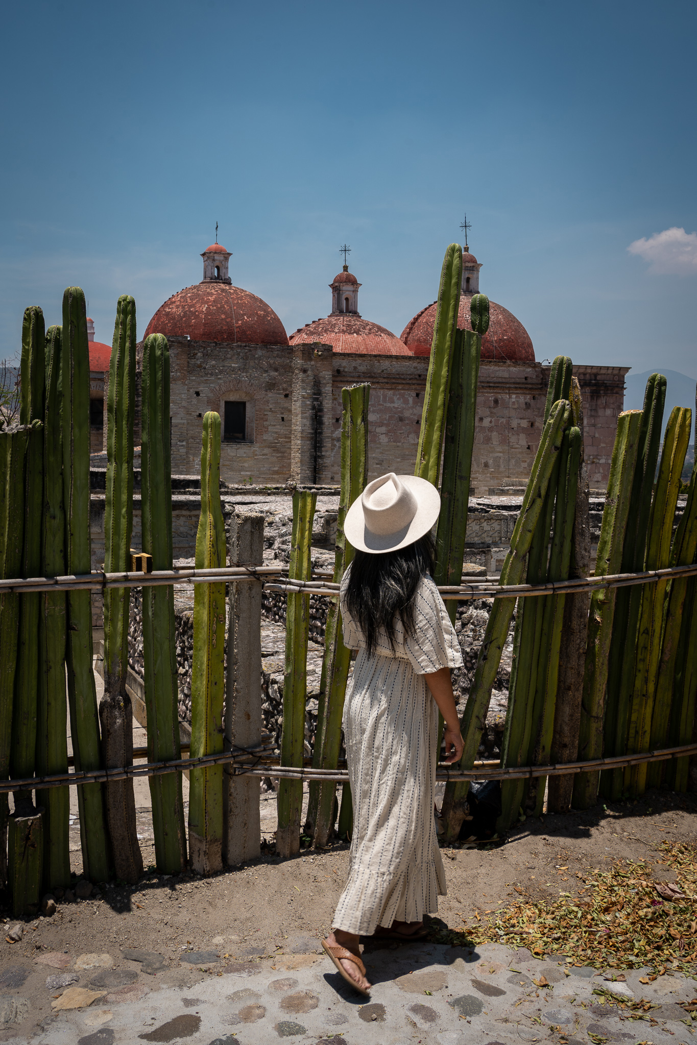 http://schimiggy.com/wp-content/uploads/2021/05/Mitla-Ruins-Oaxaca-Mexico-Gigi-Pip-Zephyr-Hat-World-Market-Kaftan-Dress-Sak-Sandals.jpg