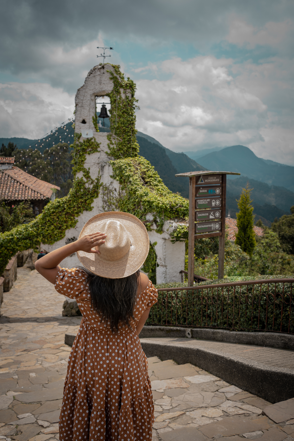 Cerro Monserrate Hill in Bogota Colombia Caroline Constas dress lack of color hat