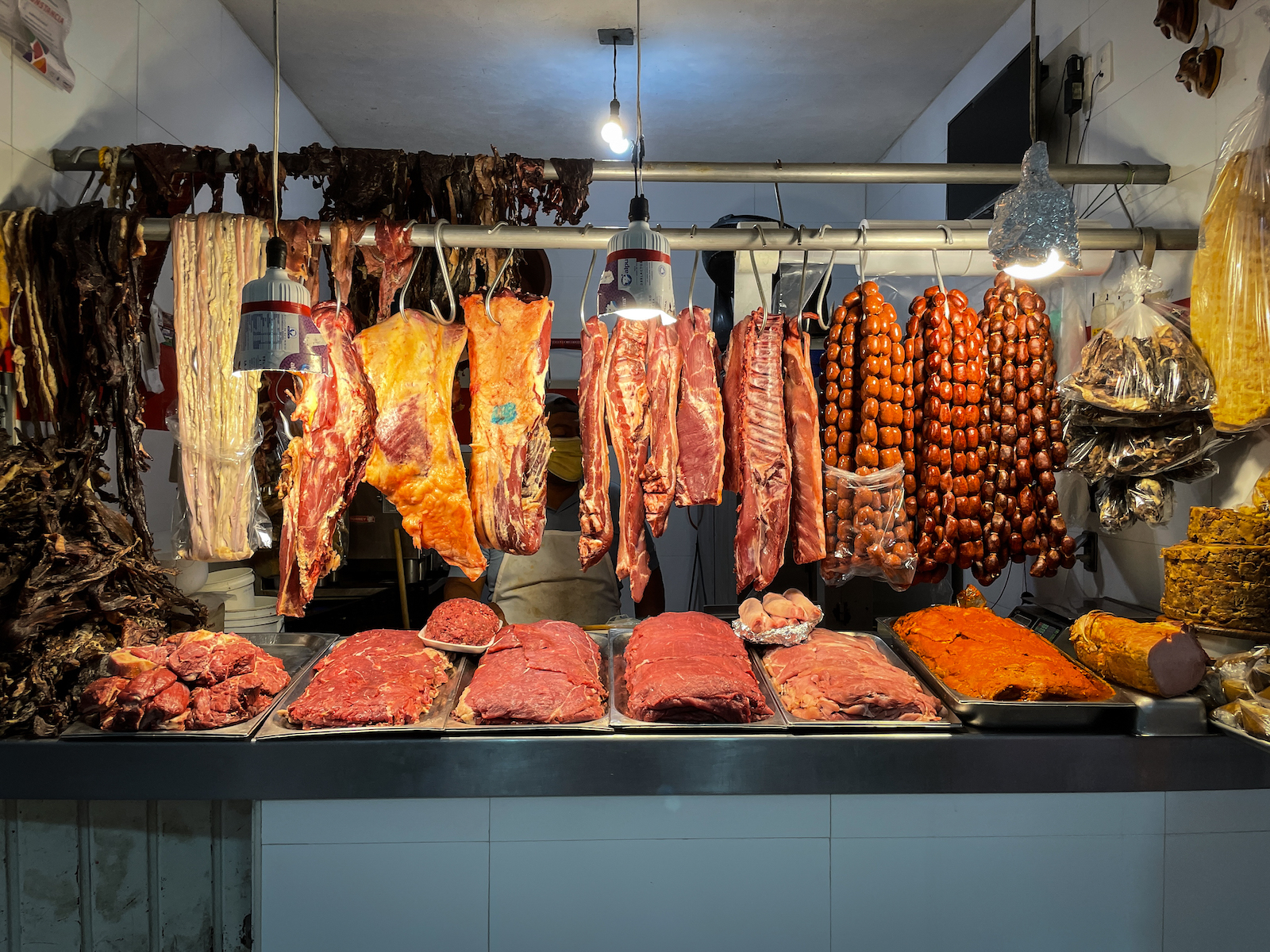 Meat butcher stall in Benito Juarez Market Oaxaca Mexico